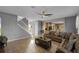 Comfortable living room showcasing an open floor plan with easy access to the kitchen and staircase at 7621 Brightwater Pl, Oviedo, FL 32765