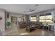 Cozy living room featuring neutral tones, an open layout, and large windows offering scenic views at 7621 Brightwater Pl, Oviedo, FL 32765