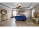 Main bedroom with decorative ceiling fan, neutral tones, and abundant natural light at 7621 Brightwater Pl, Oviedo, FL 32765