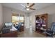 Office space with natural light, built-in shelving, and dark wood desk at 7621 Brightwater Pl, Oviedo, FL 32765