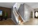 Bright staircase with skylight and wooden treads, leading to upper level of home at 7621 Brightwater Pl, Oviedo, FL 32765