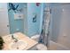 Bathroom with a Finding Nemo theme, a tub and a vanity with light blue walls at 7682 Sir Kaufmann Ct, Kissimmee, FL 34747