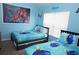 bedroom with Finding Nemo themed bedding, decor and natural light from the window at 7682 Sir Kaufmann Ct, Kissimmee, FL 34747