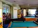 Spacious game room with pool tables and arcade games at 7682 Sir Kaufmann Ct, Kissimmee, FL 34747
