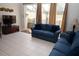Comfortable living room with large sliding glass doors leading to a screened-in patio at 7682 Sir Kaufmann Ct, Kissimmee, FL 34747
