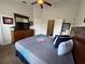 Comfortable main bedroom with a large bed, coordinating decor, and natural light from the windows at 7682 Sir Kaufmann Ct, Kissimmee, FL 34747