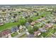 Aerial shot of a residential neighborhood with well-maintained homes, green spaces and lush trees at 857 Marquis Ct, Kissimmee, FL 34759