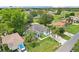 Aerial view of the property featuring its blue exterior and surrounding landscape at 857 Marquis Ct, Kissimmee, FL 34759