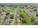 Aerial shot of a residential neighborhood with green spaces, orderly streets, and nicely maintained lawns at 857 Marquis Ct, Kissimmee, FL 34759