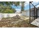 Backyard view of the property with a pool, fence, and green grass at 857 Marquis Ct, Kissimmee, FL 34759