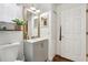 Cozy bathroom featuring a gray vanity with a vessel sink and an attractive framed mirror at 857 Marquis Ct, Kissimmee, FL 34759