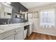 The bathroom features a double vanity with modern sinks and gray cabinets and shiplap accent wall at 857 Marquis Ct, Kissimmee, FL 34759