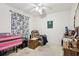 Traditional bedroom with a ceiling fan, recliner, and desk area with lots of space at 857 Marquis Ct, Kissimmee, FL 34759