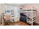 Cute bedroom with pink accents, a modern desk, and comfortable bunk beds at 857 Marquis Ct, Kissimmee, FL 34759