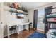 Inviting bedroom with desk, storage shelves and a bunk bed bathed in natural light at 857 Marquis Ct, Kissimmee, FL 34759