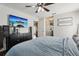 A view of the main bedroom with hardwood floors and a television mounted on the wall at 857 Marquis Ct, Kissimmee, FL 34759