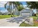 A beautiful single-story home features a two-car garage and a large driveway perfect for multiple vehicles at 857 Marquis Ct, Kissimmee, FL 34759