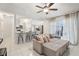 Bright, open-concept living space with kitchen access, ideal for seamless living and entertaining at 857 Marquis Ct, Kissimmee, FL 34759