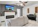 Cozy living room with fireplace and neutral colors, perfect for a relaxing space at 857 Marquis Ct, Kissimmee, FL 34759
