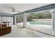 Enclosed patio opens to a private pool area, perfect for relaxation and recreation at 857 Marquis Ct, Kissimmee, FL 34759