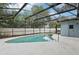 Inviting private pool area with a fully screened enclosure and well maintained concrete perimeter at 857 Marquis Ct, Kissimmee, FL 34759
