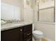 Bathroom with granite countertop sink and toilet at 8912 Rhodes St, Kissimmee, FL 34747