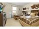 Bedroom featuring twin beds, wood furnishings, and decorative wall art at 8912 Rhodes St, Kissimmee, FL 34747