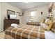 Bedroom featuring twin beds, wood furnishings, and decorative wall art at 8912 Rhodes St, Kissimmee, FL 34747