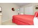 Cozy bedroom featuring a comfortable bed, dresser with a TV, and neutral decor at 8912 Rhodes St, Kissimmee, FL 34747