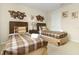 Bedroom featuring twin beds, wood furnishings, and decorative wall art at 8912 Rhodes St, Kissimmee, FL 34747