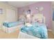 Charming bedroom featuring twin beds with bright Frozen-themed bedding and decor at 8912 Rhodes St, Kissimmee, FL 34747