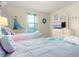 Charming themed bedroom featuring two twin beds, playful decor, and a bright ambiance at 8912 Rhodes St, Kissimmee, FL 34747