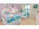 Themed bedroom featuring two twin beds, fun decor, and a bright ambiance at 8912 Rhodes St, Kissimmee, FL 34747
