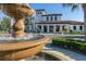 Community clubhouse featuring landscaping and water fountain in front of the main entrance at 8912 Rhodes St, Kissimmee, FL 34747