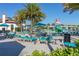 Resort-style community pool area with lounge chairs, umbrellas, and a splash pad, perfect for Gathering fun at 8912 Rhodes St, Kissimmee, FL 34747