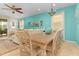 Dining room with a large wooden table and seating for eight at 8912 Rhodes St, Kissimmee, FL 34747