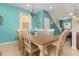 Dining room with seating for eight and view to front entryway at 8912 Rhodes St, Kissimmee, FL 34747