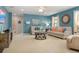 Inviting living room with neutral furnishings, a stylish coffee table, and an abundance of natural light at 8912 Rhodes St, Kissimmee, FL 34747