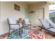 Covered outdoor seating area featuring an outdoor rug and access to the exterior of the property at 8912 Rhodes St, Kissimmee, FL 34747
