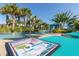Lounge chairs near a lazy river pool, and a menu showing drink options at 8912 Rhodes St, Kissimmee, FL 34747