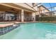 Screened in pool featuring tile trim, a small water fall feature, and sun bathing deck at 8912 Rhodes St, Kissimmee, FL 34747