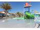 Resort-style pool with water features, slide and community clubhouse at 8912 Rhodes St, Kissimmee, FL 34747