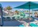Resort-style pool area with lounge chairs, umbrellas, and water slides for Gathering fun at 8912 Rhodes St, Kissimmee, FL 34747