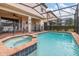 Private screened pool and spa area featuring outdoor seating at 8912 Rhodes St, Kissimmee, FL 34747