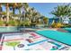 Leisure poolside view with lounge chair and drink menu, with tropical trees and cabana at 8912 Rhodes St, Kissimmee, FL 34747