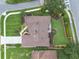 Aerial view of a house showcasing its roof, landscaping, and surrounding neighborhood at 9324 Carolview Way, Orlando, FL 32836