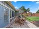 Backyard patio with a brick paver patio, outdoor table, chairs and grill at 9324 Carolview Way, Orlando, FL 32836