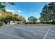 The community has a basketball court with beautiful landscaping and blue skies at 9324 Carolview Way, Orlando, FL 32836