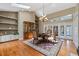 Dining room with wooden floors, built-ins, and natural light complements the dining experience at 9324 Carolview Way, Orlando, FL 32836