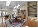 Dining room with skylights and chandelier, adjacent built-ins, and beautiful table and chairs at 9324 Carolview Way, Orlando, FL 32836